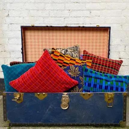 Cushion covers in production inside suitcase